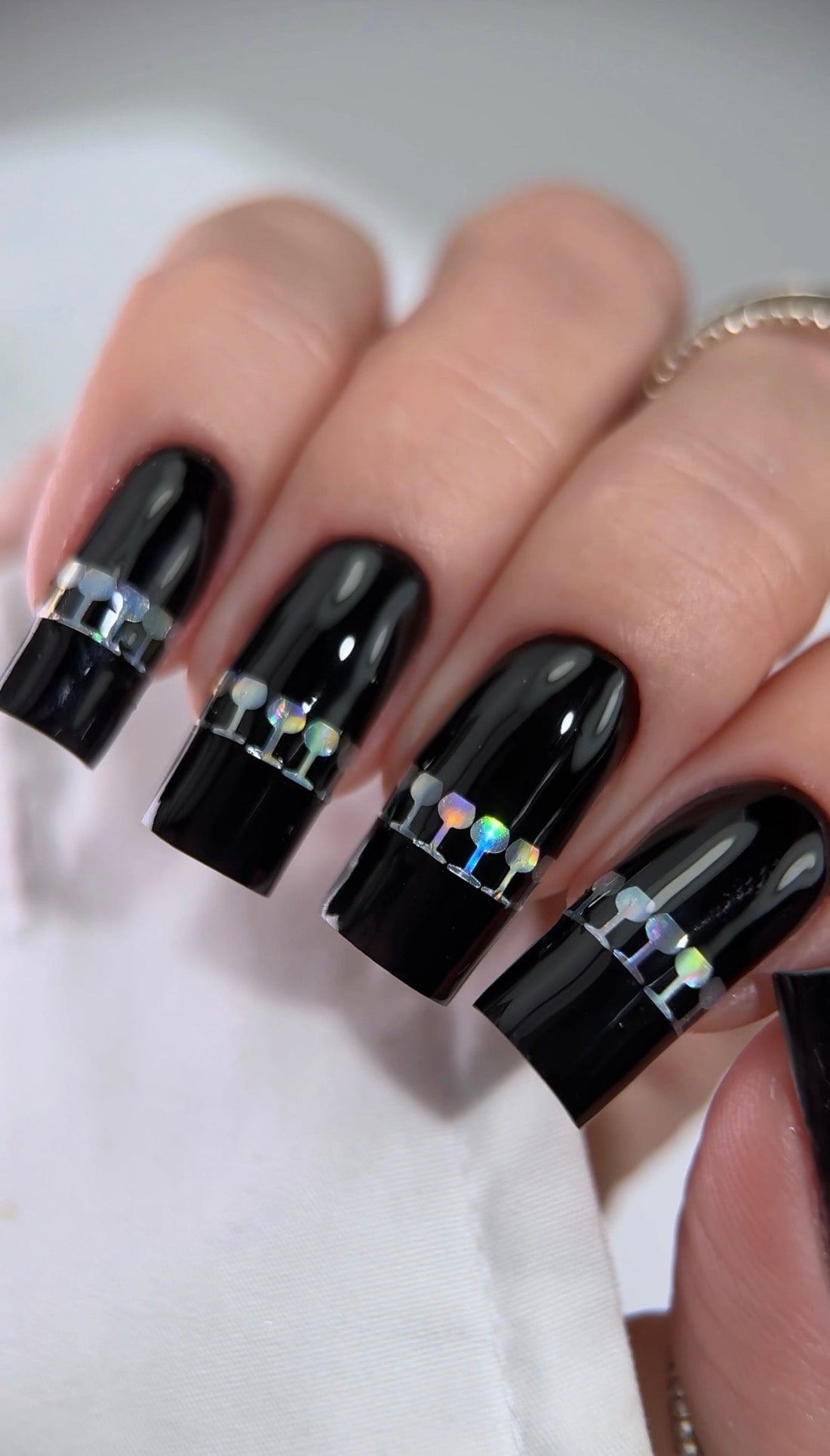     Glossy black gel nails with a high shine finish on almond shaped nails