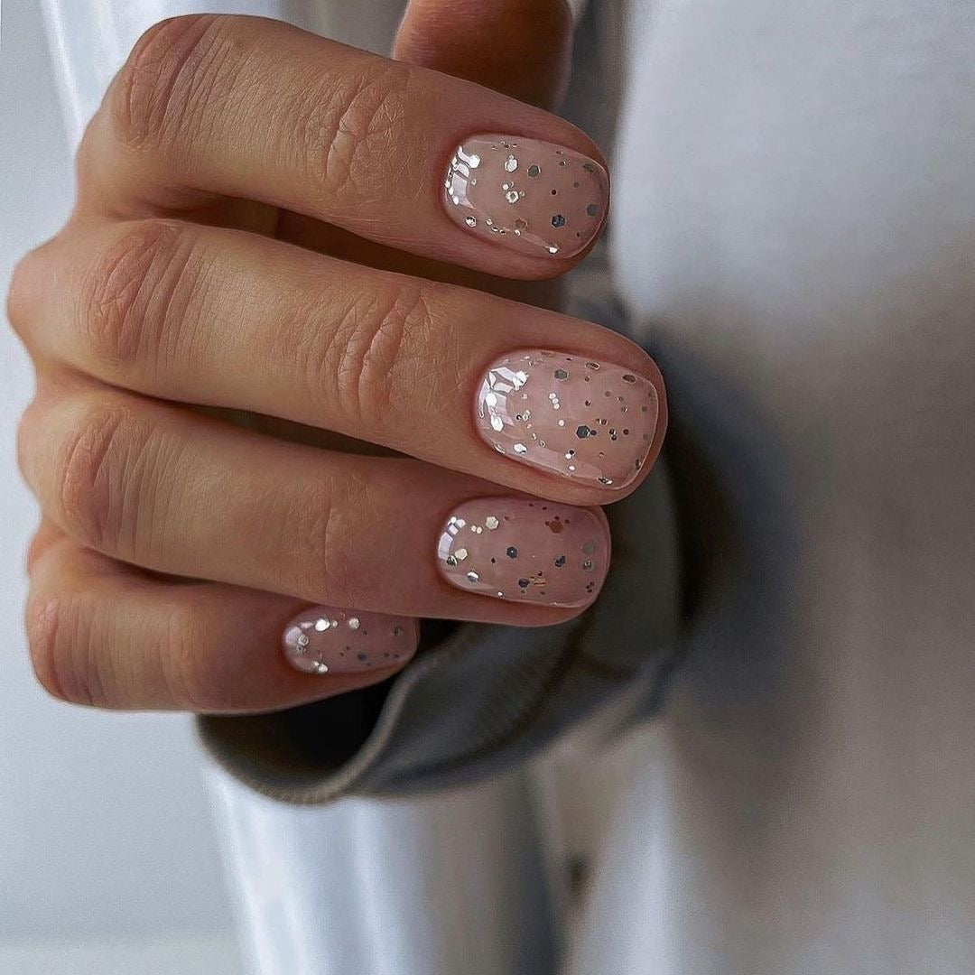     Encapsulated glitter nails with sparkling glitter sealed under clear builder gel.