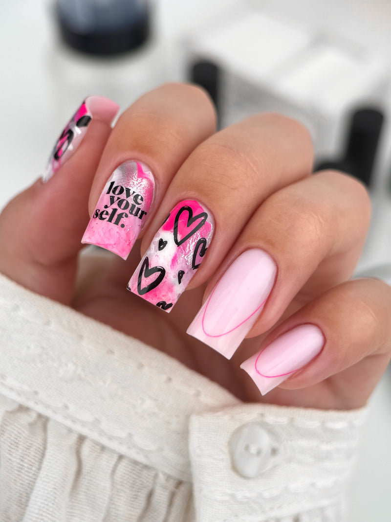 GLOSS nail stamping technique in action — transferring design from plate to nail